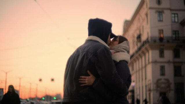 soft focus and noise on video. A couple in love meets in the city in winter in winter clothes, love after separation.