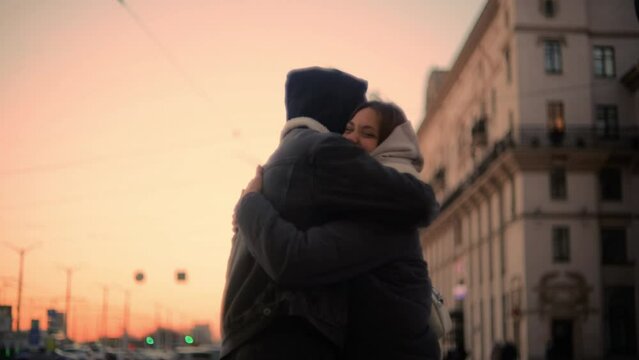 soft focus and noise on video. A couple in love meets in the city in winter in winter clothes, love after separation.