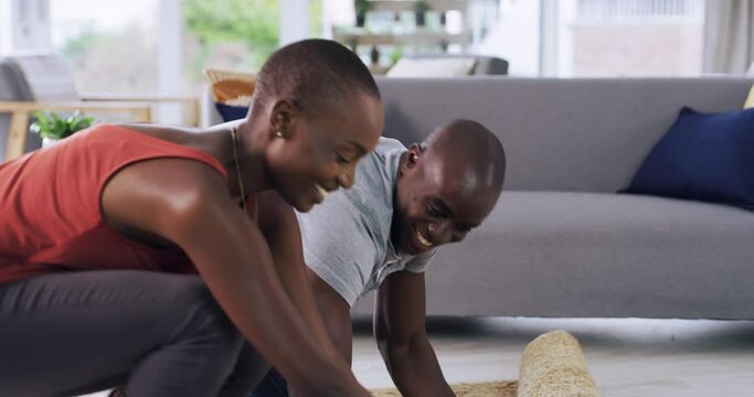 Carpet, unpacking or black couple in living room of new home for investment, property or real estate. Start, rolling mat or African woman with happy man in a house or apartment for rent or homeowner