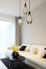 Elegant living space with modern pendant lighting