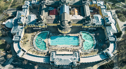Aerial drone view of the famous Szechenyi Thermal Bath and Spa on a sunny autumn day in Budapest, Hungary. High quality photo