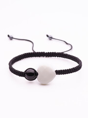 black shungite bracelet with solidified lava on a white background isolate