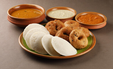 food South Indian food idli vada with sambar on a banana leaf