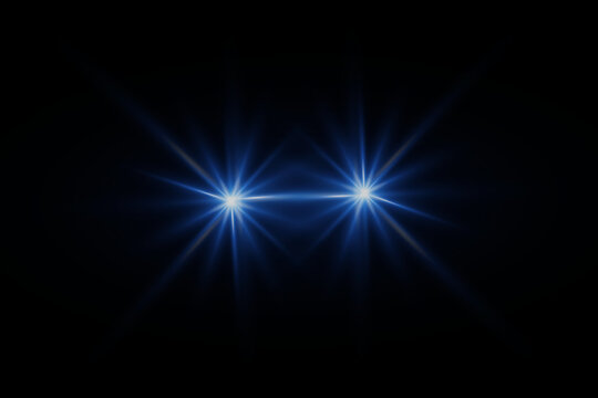 A lens flare representing a camera flash with a special light effect. On a dark background.