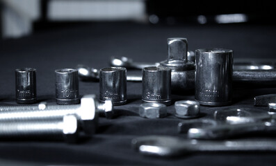 Variety Hardware Products On Black Workbench Closeup Angle View 
