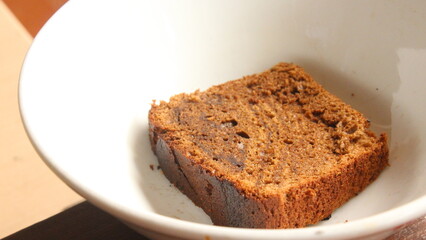 a slice of brownies on a bowl