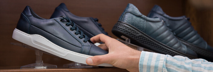 Fototapeta premium man shopping shoes in shop