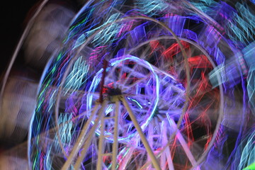 Long Exposure of Spinning Carousel. Abstract Carnival Background