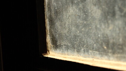 Close up of a dusty glass window