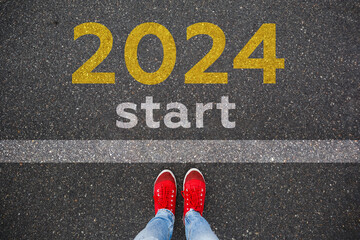 2024 written on asphalt road. New year 2024 concept photo. New year new beginnings