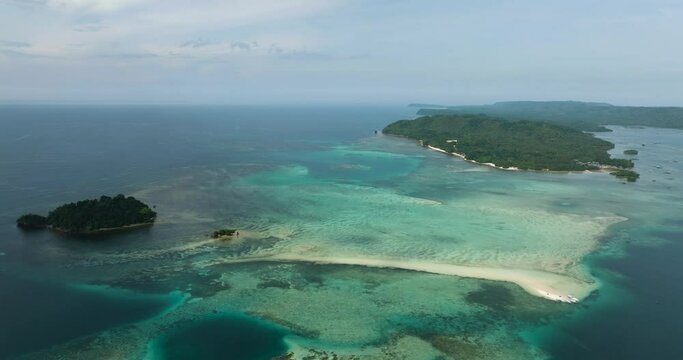Aerial view of Tropical Islands with beaches and coral reefs. Barobo, Surigao del Sur. Philippines.
