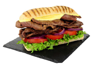 Panini beef steak and salad sandwich with lettuce, tomato and red onion