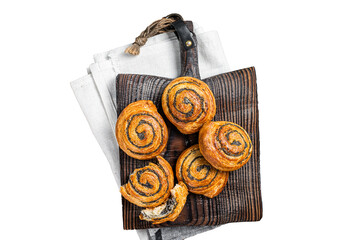 Poppy seed rolls and cardamom buns, Traditional Nordic baked sweet breads on wooden board. ...