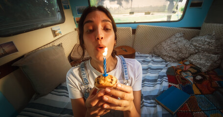 Portrait of Happy Female Holding a Birthday Cupcake Muffin with a Candle. Loving Tourist Couple Living in a Caravan, Blowing Out a Candle. POV Footage