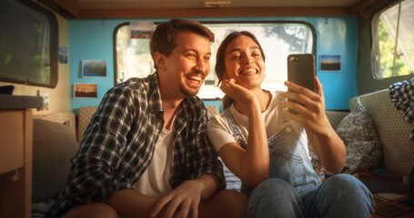 Happy Smiling Couple Taking a Selfie Photo for Family, Relatives or Friends. Having Funny Conversations on Video Call. Young Man and Woman Travelling in a Motorhome, Recording Video for Social Media