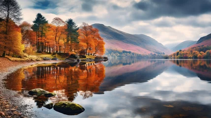 Wall murals Reflection Fall in the Lake District. Colorful trees reflected in a calm water surface. A bright and vibrant landscape scene, autumn nature background