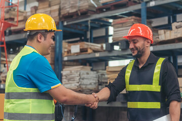 Teamwork Warehouse worker shakehand together. Engineer man hands partnership. Diversity Coworker...