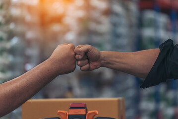 Diversity Teamwork Warehouse worker fist bump together trust partner. Engineer man, women hands...