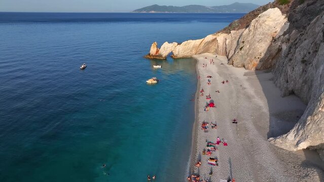 The beautiful beach of Lalaria with shining, turquoise sea during sunset time, Skiathos island, Sporades, Greece