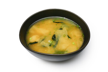 Miso soup with tofu and Wakame seaweed in brown Japanese bowl