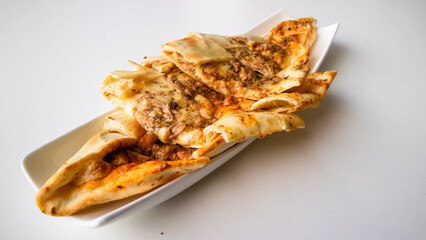 Turkish pide with tuna- from the Offset Collection, Turkish bread pide, Turkish tuna pizza.