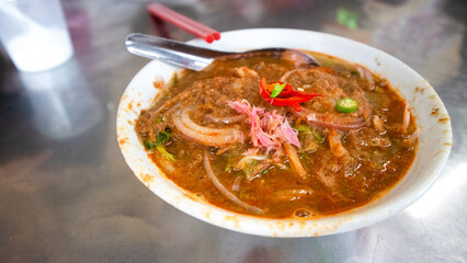 Penang Laksa - Spicy soup noodle in the Peranakan cuisine, Assam Laksa (Noddle in Tangy Fish Gravy) is a Special Malaysian Food Popular in Penang 