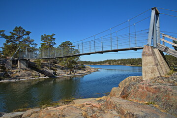 Suspension bridge on hiking track on Stora Krokholmen in Stendörrens Naturreservat in Sweden, Europe
