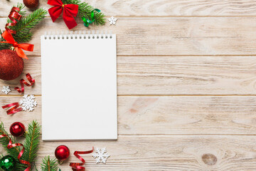 Christmas blank greeting card mock-up scene. Creative layout made of Christmas tree branches and...