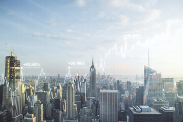 Abstract virtual financial graph hologram on New York cityscape background, financial and trading...