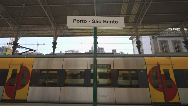 Portugal, Porto. Sao Bento train station platforms with train. Trains at Porto Sao Bento railway station public transport transit. Old atmospheric railway terminal in Oporto. 