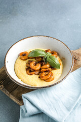 A traditional Italian dish is polenta. Venetian shrimps with polenta