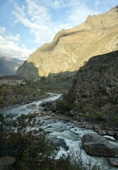 Fototapeta na wymiar The Urubamba River in Peru in The Sacred Valley with The Andes Mountain range behind. 