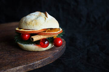 Christmas burger on a wooden board on a dark background