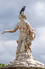 White marble statues of Versailles castle in the city of Paris - PARIS, FRANCE - June 27, 2012.