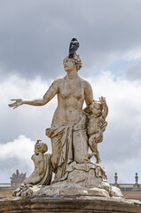 White marble statues of Versailles castle in the city of Paris - PARIS, FRANCE - June 27, 2012.