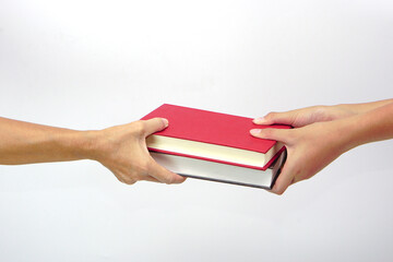 Two people exchanging books or sharing books on white background. exchanging knowledge and...