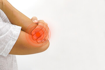 Woman suffering from elbow pain on white background. Healthcare and office syndrome concept.