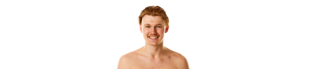 Naklejka premium Banner. Young attractive man, smiling with teeth, naked guy looking at camera against white studio background.