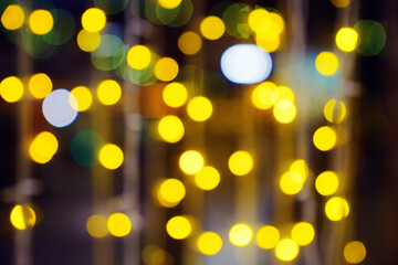 Fototapeta premium Selective focus. A garland of light bulbs on the window. 