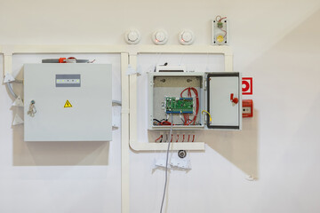 Energy equipment. Power panel with digital board. Small electrical cabinets on wall. Automation equipment. Single board computer for robotization production process. Plant electrical infrastructure