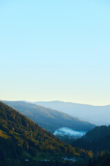 Tranquil Alpine Majesty: Verdant Peaks and Serene Valleys