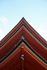 Red Japanese Pagoda in Tokyo from below and blue sky