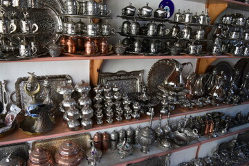A tinsmith's shop.Copper products on the shelves