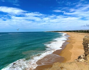 view from the Faro de Trafalgar lighthouse along the beach towards Zahora, Playa de las Plumas,...