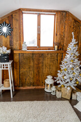 Christmas interior of the living room. The attic room of the house.