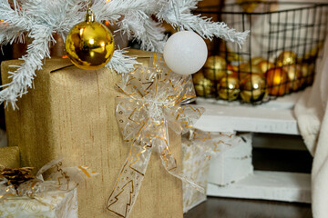 Christmas decorations. A gift under a white Christmas tree.