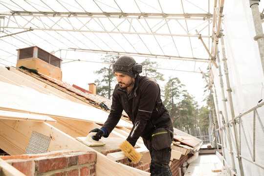 Bricklayer working on construction site