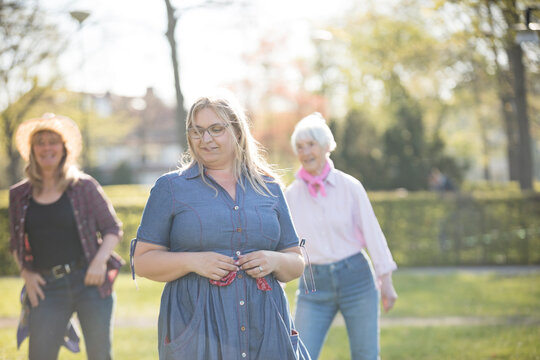Women dancing together in park