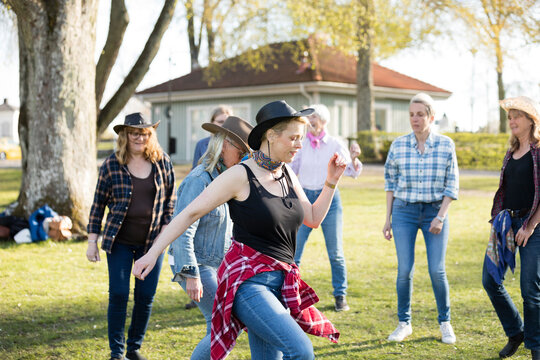 Woman dancing together in park