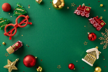 Embrace the New Year vibe with a top-down view. Red-gold baubles, train and house tree toys, party glasses, and confetti on green, leaving space for your message